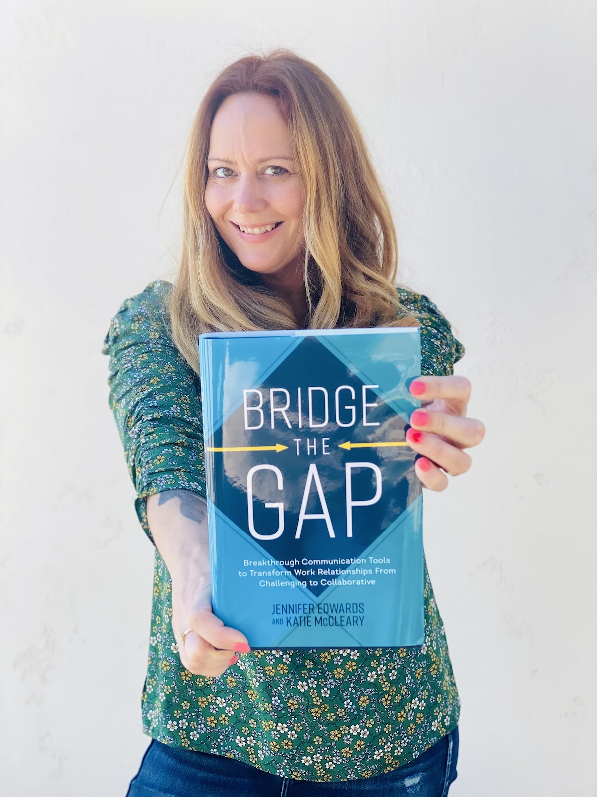 Katie McCleary holds new book "Bridge the Gap"