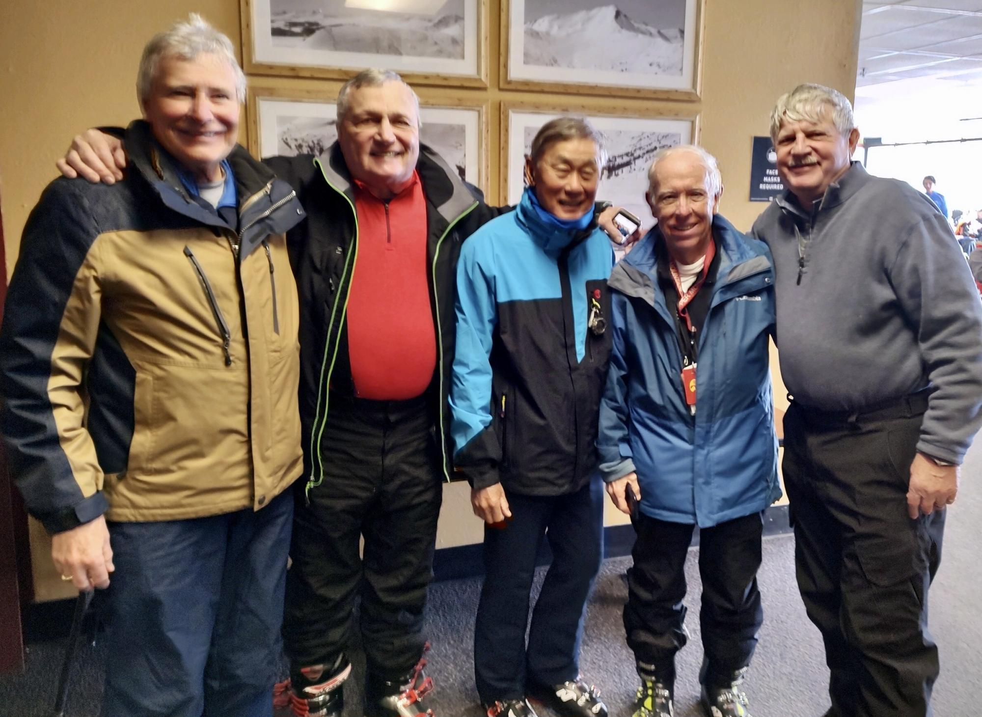Five optometry alumni pose together at Copper Mt. ski retreat.