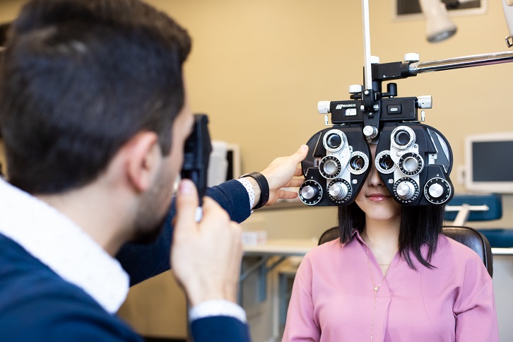 Girl receives optometry exam