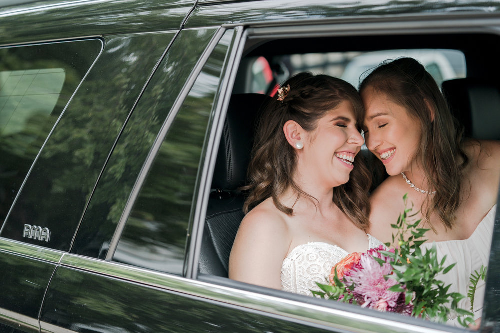 Whitney Osborn and Maggie Wigness happy brides