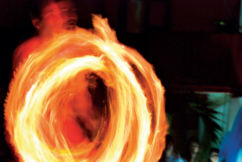 Student performing a fire dance