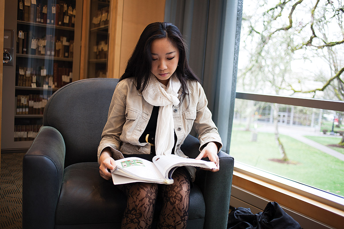 Celine Yip in the library studying.