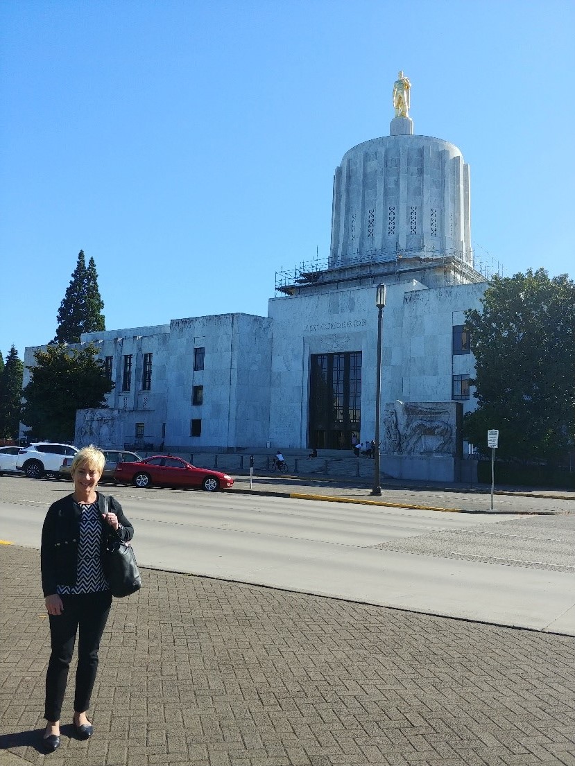 Dr. Reisch in front of the Oregon State Capitol Building