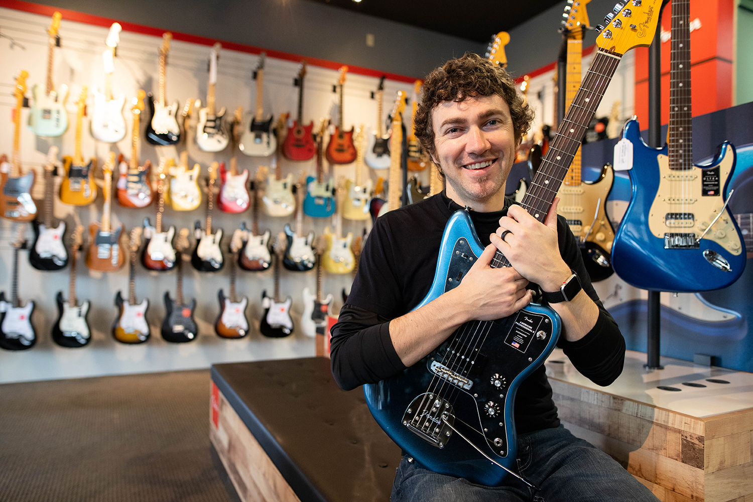 Jeremie Murfin '02 inside his shop Five Star Guitars.