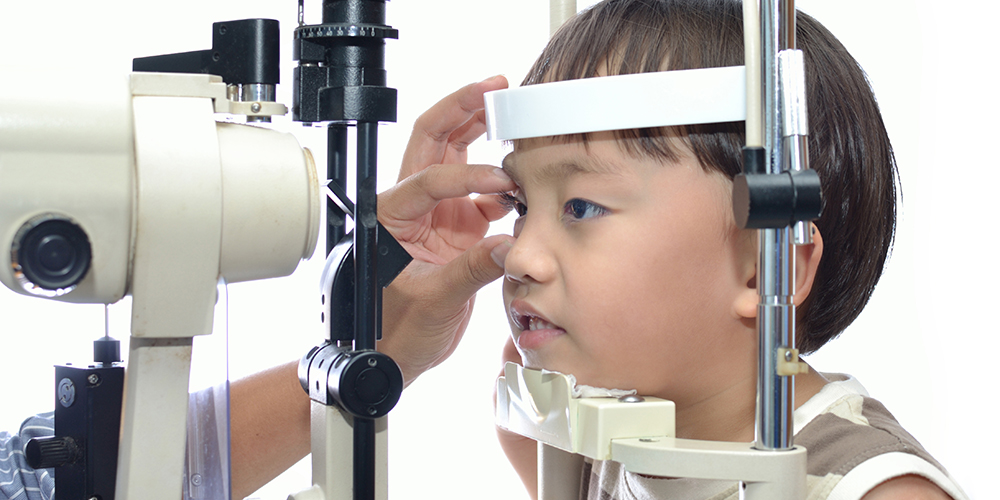 Child being examined by eye doctor