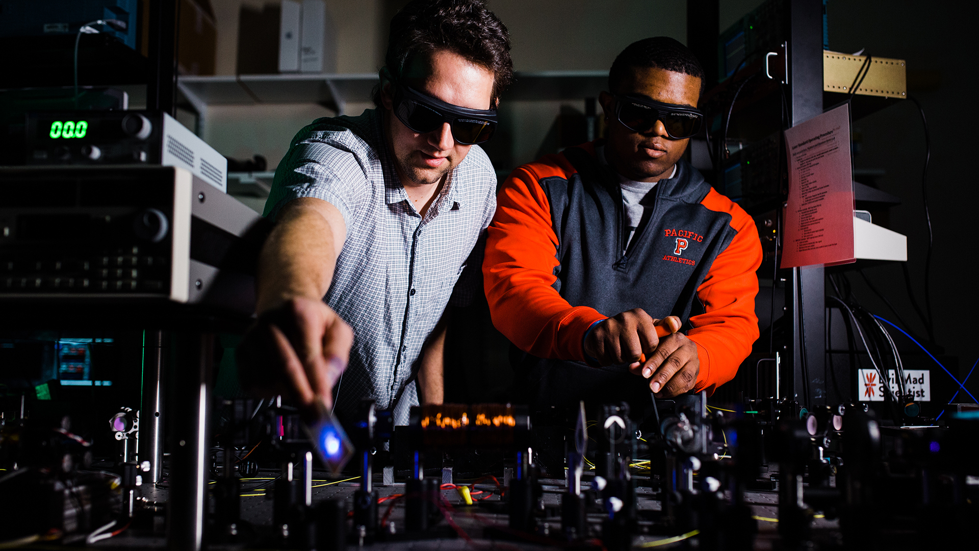 Professor Andy Dawes and Kevin McGee '18 in Pacific's physics and engineering department laser lab