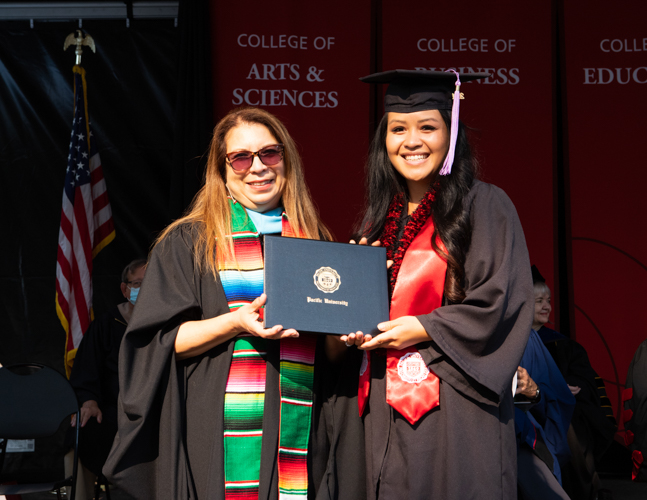 Fiona Phenouvong receives award at August commencement