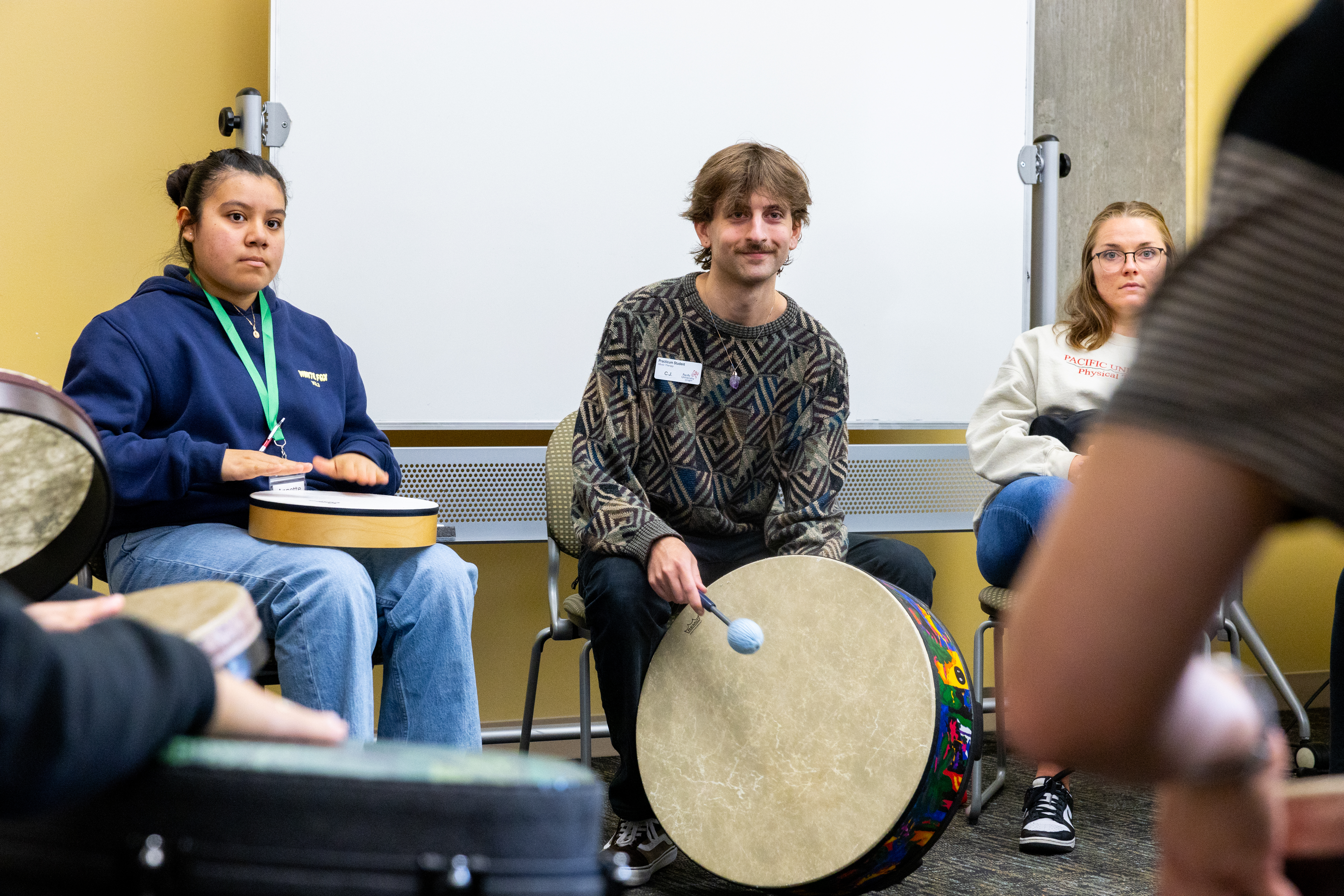 students at Pacific University playing drums