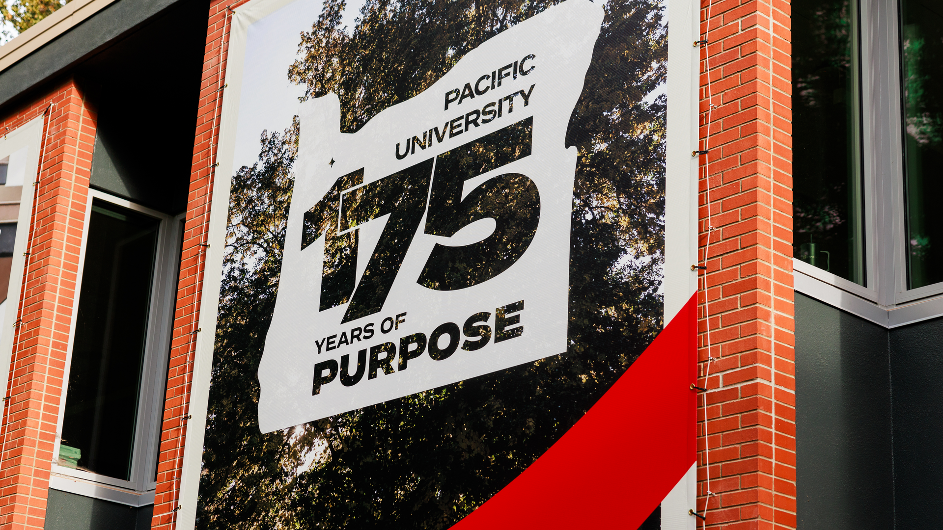Close-up of banner that reads Pacific University 175 Years of Purpose