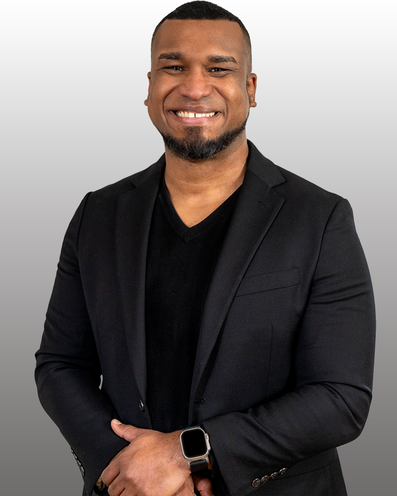 James Reyes wearing a black shirt and jacket