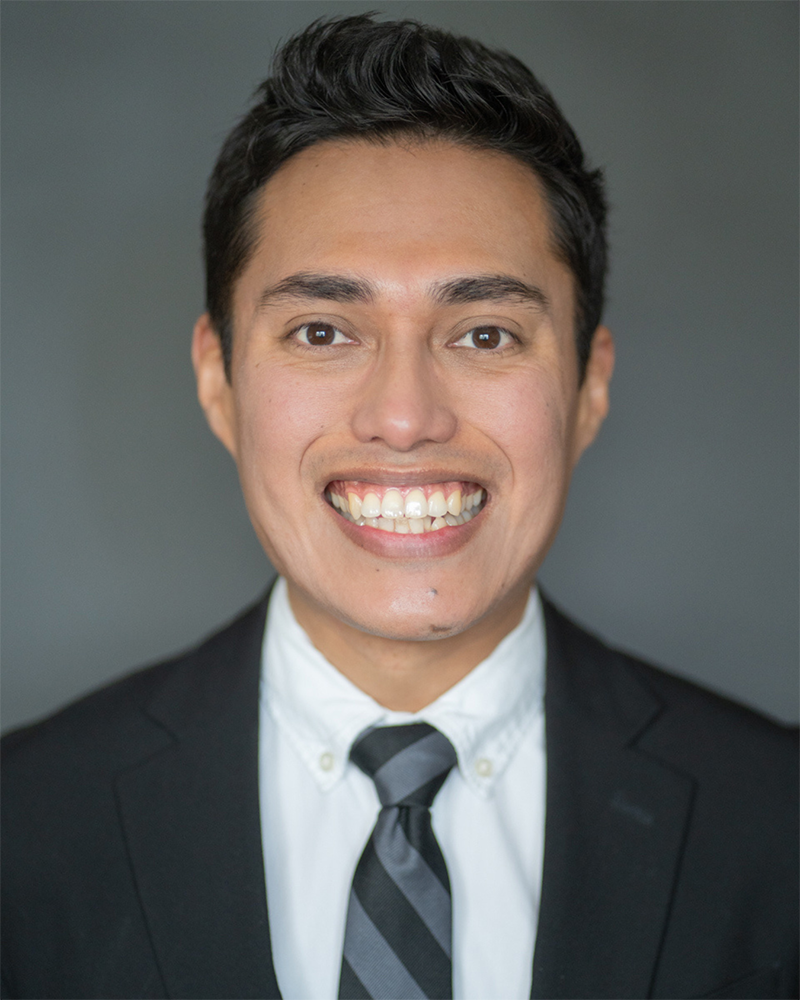 Jorge Rodriguez wearing a shirt and tie