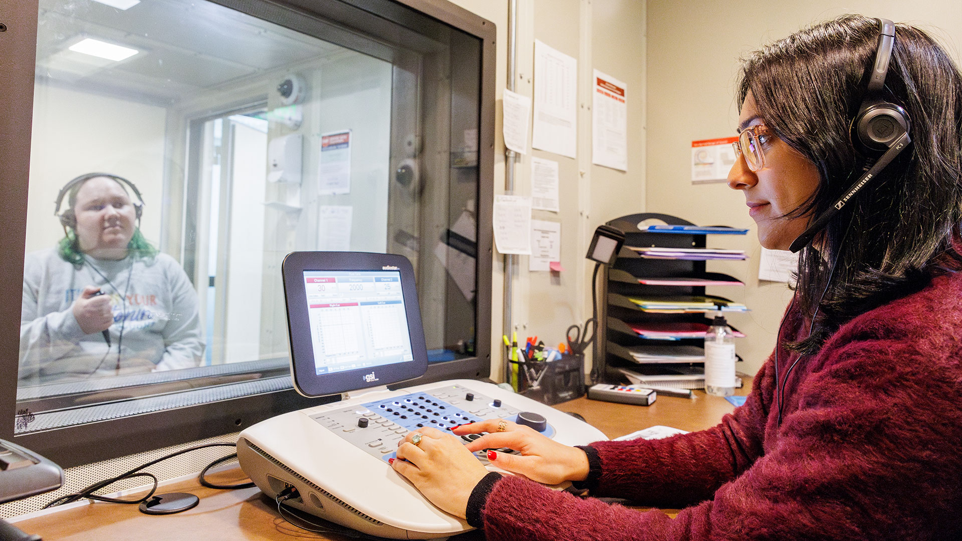 Keagan Weis and Bismaad Gahra Practice Giving A Hearing Screening