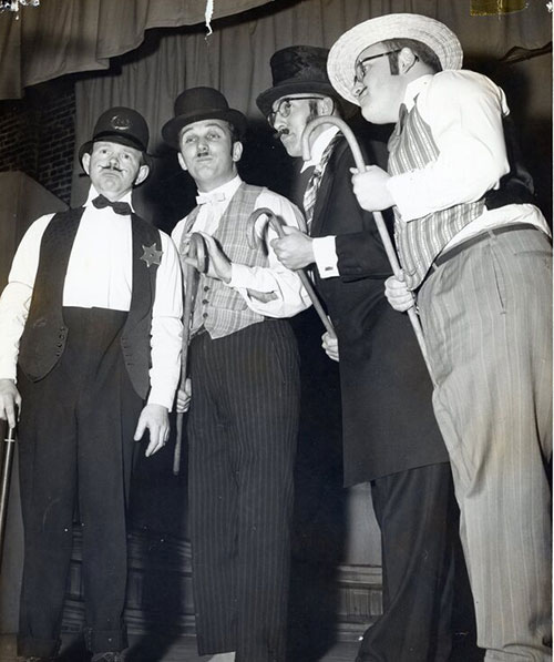 Barbershop quartet with men in period costume.