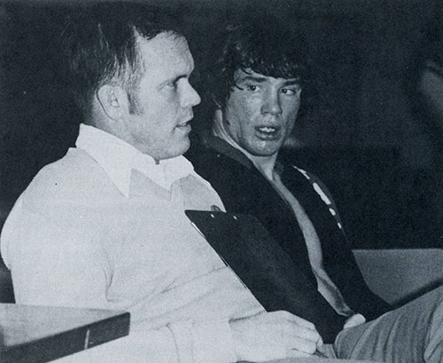 Mike Clock, left, speaking with wrestler Stacy Smith.