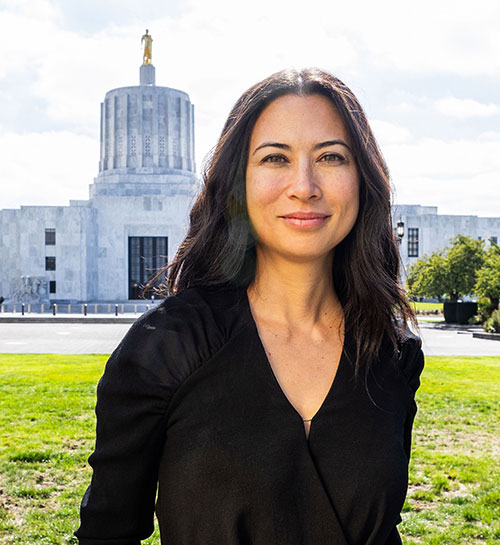 Rebecca Schoon Standing In Front Of The Oregon State Capital
