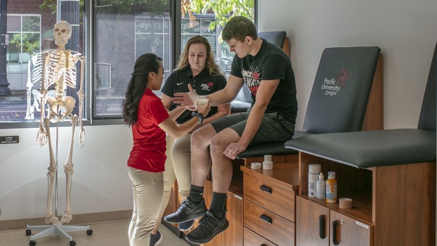 athletic training student with a client