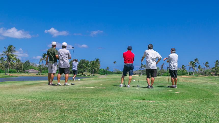 Five golfers enjoying a day on the course