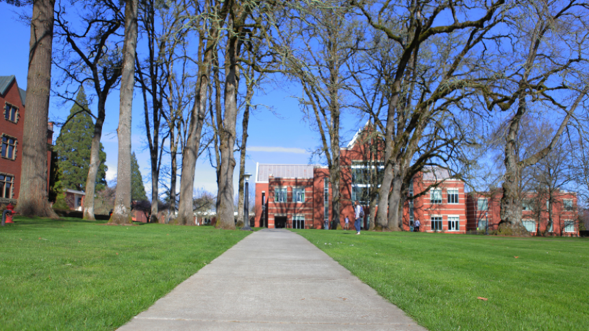walkway across quad with Tran Library in the distance