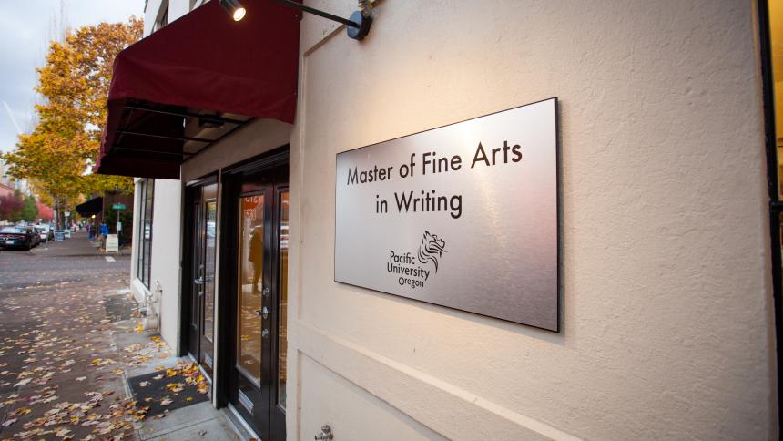 The exterior of the downtown Portland MFA building with a sign that reads Master of Fine Arts in Writing.