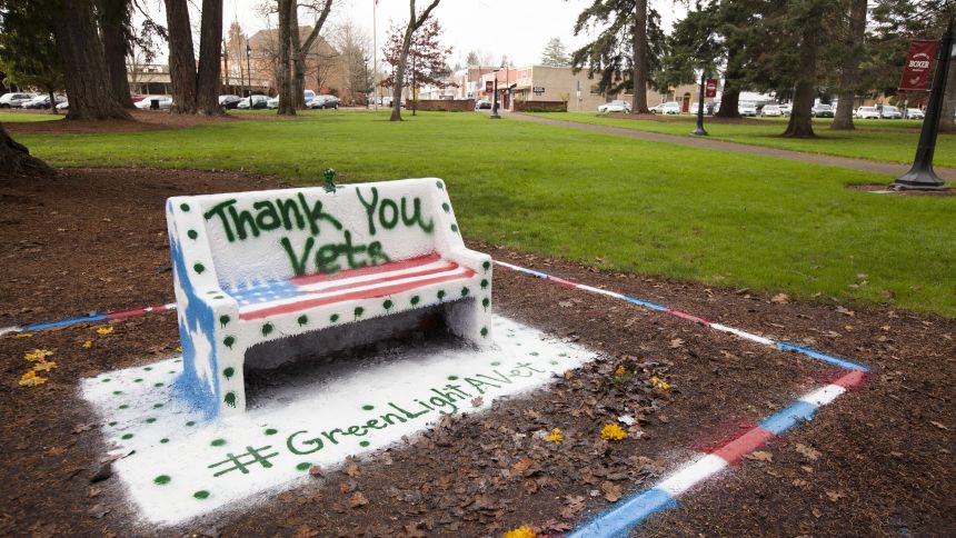 The Spirit Bench on Pacific University's Forest Grove Campus is decorated to celebrate veterans.