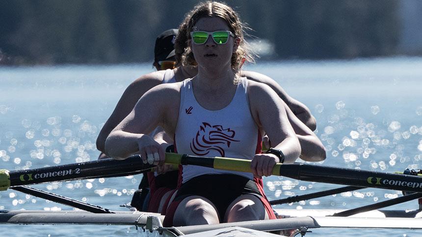 Pacific Rowing Student-Athlete In Front Of Boat At Hagg Lake
