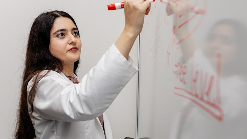 Pacific School of Pharmacy Student Hoda Veshagh Writing On A White Board