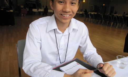 A Pacific University student prepares to talk to employers at a school-sponsored career networking event.