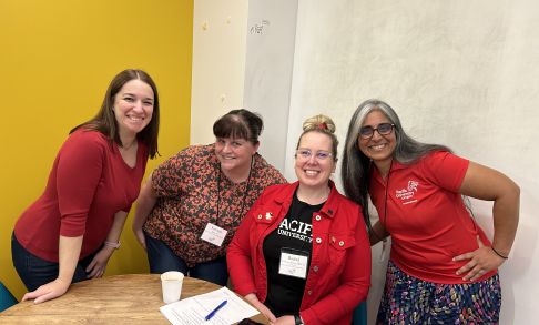 Photo of four members of the Alumni Association during a breakout discussion during the August 2025 meeting.