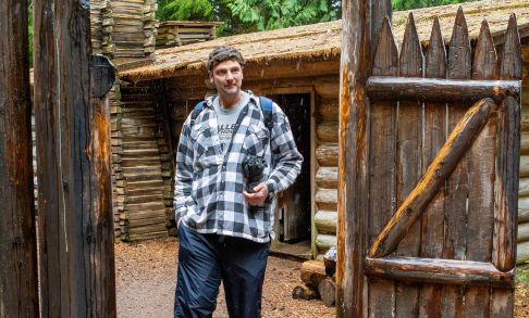 Andy Haugen Stands At The Gate To Fort Clatsop With Rain Falling