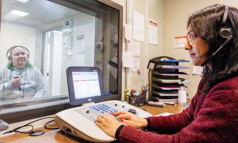 Keagan Weis and Bismaad Gahra Practice Giving A Hearing Screening