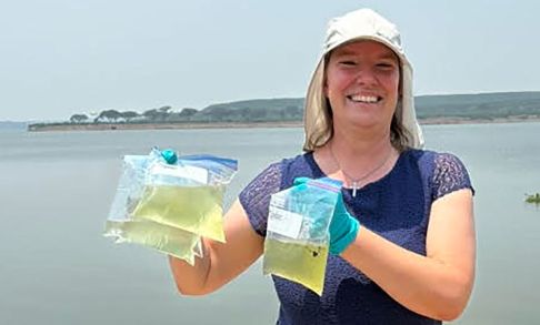 Bonnie Bolkan Displaying Water Samples Stored In Sandwich Bags