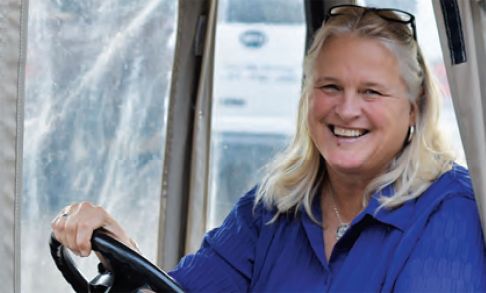 Cindy Schuppert '83 Riding In Golf Cart