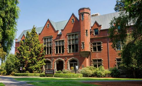 A photo of Pacific University's Marah Hall surrounded by green lawns.