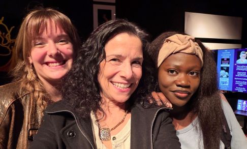 Nancy Miller Gomez poses with UC Santa Cruz intern Naomi Garrett and Youth Poetry Collective member Vicky Tinnell at a book launch event.