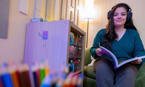 A Student Relaxes With A Book Inside Pacific's New Sensory Room