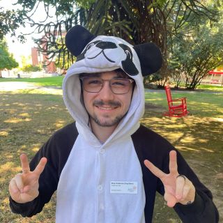 Peer tutor River Anderson in a panda onesie