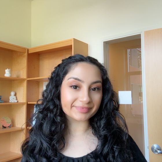 Picture of Dr. Verduzco smiling at the camera in an office