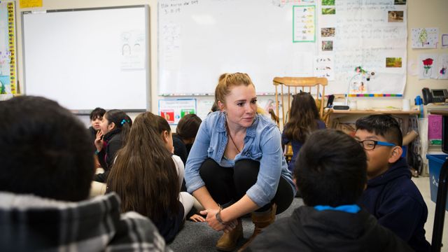 Fallon Harris '14 with students at Cornelius Elementary