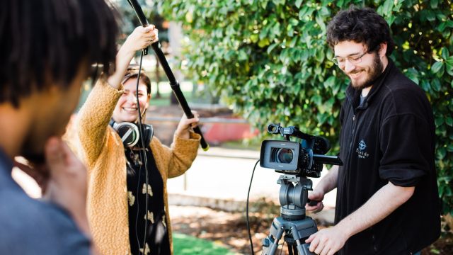 students filming outside