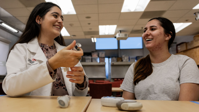 A Pacific University pharmacy student practices patient care