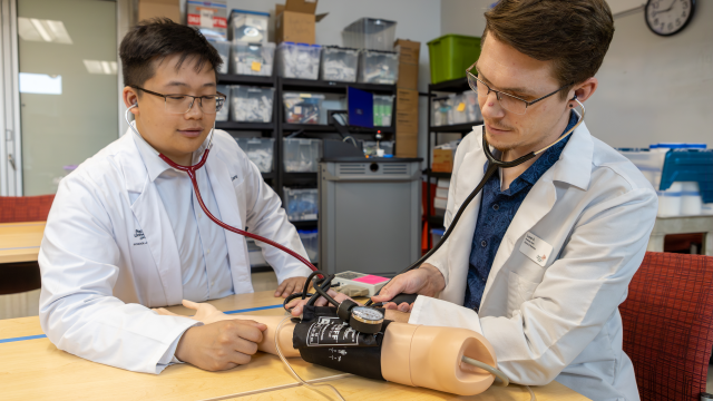 Joseph Dang PharmD '24 (left) and Lucas Daut PharmD '24 (right) practice patient care