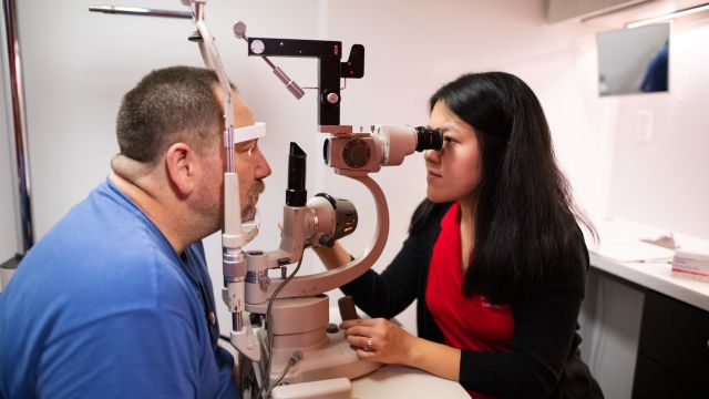 Pacific University student administering an eye test