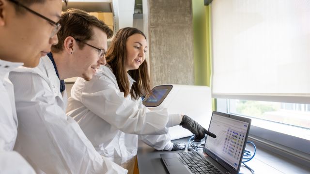 Pacific Pharmacy students look at a computer together