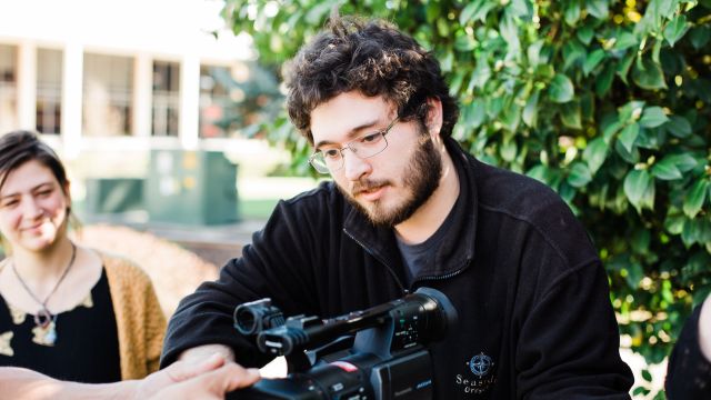 Pacific University students working with video camera