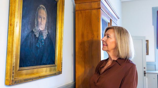Tabitha Becker '84 Looking At Portrait Of Tabitha Brown