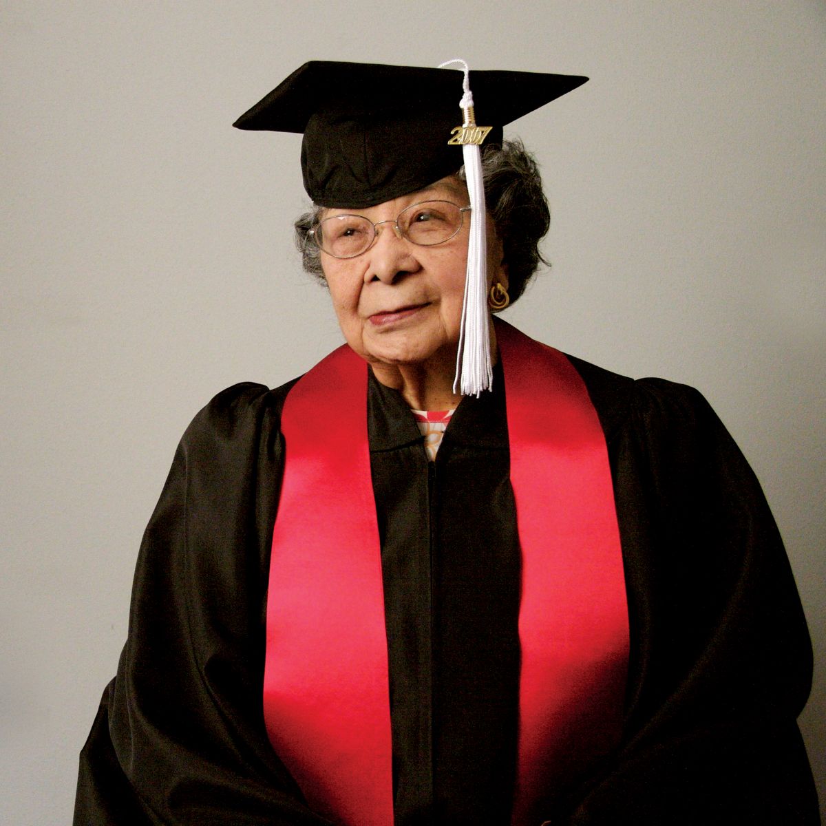 Yukie Sumoge in graduation regalia as she receives an honorary degree