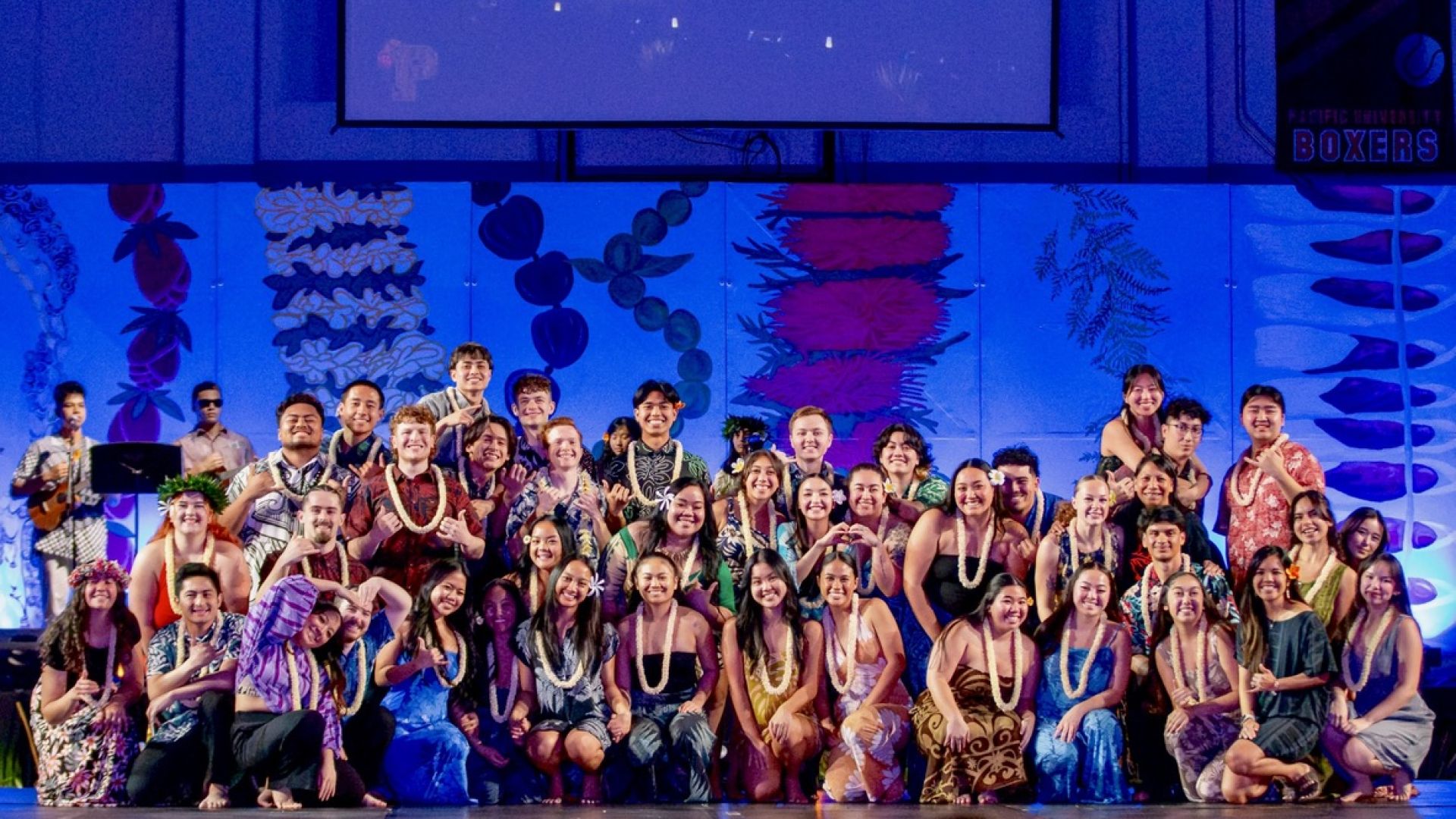 NHOH students on stage at a performance