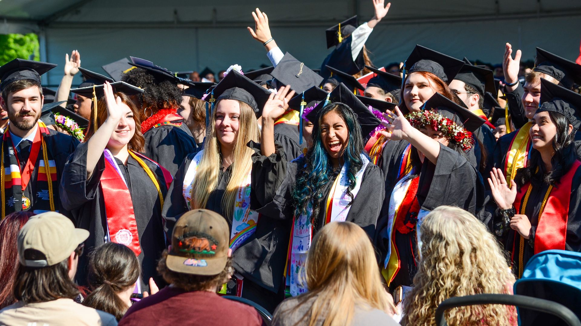 Crowd cheering on graduates from Pacific