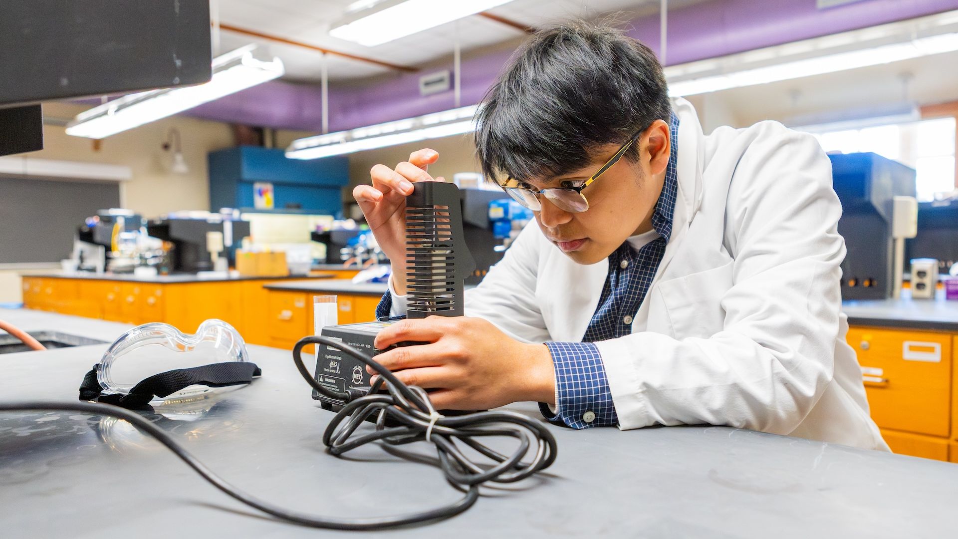 Pacific University student working in a chemistry lab
