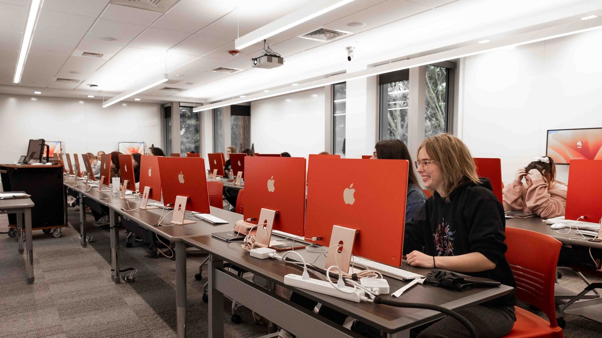 Pacific University students working at computers in a computer lab